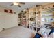 Bedroom featuring built-in bookshelves, a couch, and a neutral carpet at 2440 Ping Dr, Henderson, NV 89074