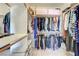 Walk-in closet with built-in shelving and clothing racks for organized storage at 2440 Ping Dr, Henderson, NV 89074