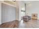 Spacious entryway with hardwood floors, a high ceiling, and large double doors at 2440 Ping Dr, Henderson, NV 89074