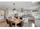 Dining area with kitchen island and stainless steel appliances at 2440 Ping Dr, Henderson, NV 89074