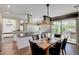 Spacious kitchen with an island and view of the outdoor space at 2440 Ping Dr, Henderson, NV 89074