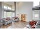 Inviting living room featuring hardwood floors, high ceilings, and sun-drenched windows at 2440 Ping Dr, Henderson, NV 89074