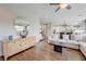 Living room area featuring hardwood floors, access to kitchen, and a view of entry at 2440 Ping Dr, Henderson, NV 89074