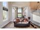Cozy living room showcasing hardwood floors, high ceilings, and comfortable seating at 2440 Ping Dr, Henderson, NV 89074