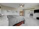 Large main bedroom with neutral carpet, a ceiling fan, and an ensuite bathroom at 2440 Ping Dr, Henderson, NV 89074