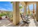 Relaxing outdoor patio featuring comfortable hammock, desert landscaping, and a serene atmosphere at 2440 Ping Dr, Henderson, NV 89074
