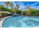 Stunning pool with a built-in spa and lush surroundings, perfect for relaxation at 2440 Ping Dr, Henderson, NV 89074
