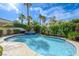 Backyard oasis with a beautiful swimming pool, spa, and lush landscaping at 2440 Ping Dr, Henderson, NV 89074