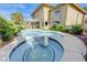 Inviting backyard pool and spa with mature landscaping, ideal for relaxing and entertaining outdoors at 2440 Ping Dr, Henderson, NV 89074