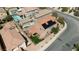 Aerial view of a two-story home with solar panels, a backyard pool, and fenced yard in a suburban neighborhood at 2529 Flodden St, Henderson, NV 89044