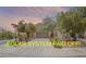 Charming home featuring well-kept landscaping, a paved driveway, and a prominent sign indicating the solar system is paid off at 2529 Flodden St, Henderson, NV 89044