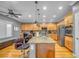 Stylish kitchen featuring an island with bar seating, granite countertops, and stainless appliances at 2529 Flodden St, Henderson, NV 89044