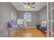 Home office featuring hardwood floors, natural light, and a ceiling fan at 2529 Flodden St, Henderson, NV 89044