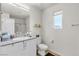 This bathroom features a single sink vanity, granite countertops, and a framed window at 2598 Polar White Ave, North Las Vegas, NV 89086