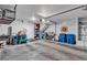 A large garage with plenty of room, storage, and a dartboard, offering space for various activities at 2598 Polar White Ave, North Las Vegas, NV 89086