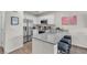 Bright kitchen featuring granite countertops, stainless steel appliances, and stylish decor at 2598 Polar White Ave, North Las Vegas, NV 89086