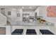 Modern kitchen with granite countertops, stainless steel appliances, and bar stool seating at 2598 Polar White Ave, North Las Vegas, NV 89086