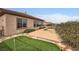 This backyard boasts a pool, putting green, and lush landscaping at 2784 Cherrydale Falls Dr, Henderson, NV 89052