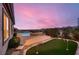 Backyard with a sparkling pool, hot tub, and putting green at 2784 Cherrydale Falls Dr, Henderson, NV 89052