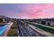 Scenic backyard view overlooking a golf course and city lights at sunset at 2784 Cherrydale Falls Dr, Henderson, NV 89052