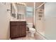 This cozy bathroom boasts vanity, toilet, and glass-door shower at 2784 Cherrydale Falls Dr, Henderson, NV 89052