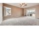 A standard bedroom with carpet and sliding glass door at 2784 Cherrydale Falls Dr, Henderson, NV 89052