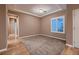 Spacious bedroom with a neutral color palette, plush carpeting, and lots of natural light at 2784 Cherrydale Falls Dr, Henderson, NV 89052