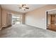 A standard bedroom with carpet and sliding glass door and view of the pool at 2784 Cherrydale Falls Dr, Henderson, NV 89052