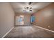 A large bedroom featuring carpet, ceiling fan, with an ensuite bathroom at 2784 Cherrydale Falls Dr, Henderson, NV 89052