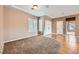 Bedroom features neutral carpet, window with blinds, and double door closet at 2784 Cherrydale Falls Dr, Henderson, NV 89052