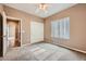 This bedroom features neutral walls, carpet, a ceiling fan, and a closet at 2784 Cherrydale Falls Dr, Henderson, NV 89052