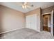 Neutral bedroom offers carpet floors, ceiling fan and double-door closet at 2784 Cherrydale Falls Dr, Henderson, NV 89052