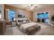 Bedroom featuring carpet, ceiling fan and sliding glass doors with access to outdoor living space at 2784 Cherrydale Falls Dr, Henderson, NV 89052