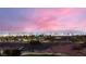 Expansive city views from this home nestled above a golf course offer an illuminated skyline at night at 2784 Cherrydale Falls Dr, Henderson, NV 89052