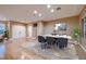Elegant dining room featuring hardwood floors, a stylish chandelier, and ample natural light at 2784 Cherrydale Falls Dr, Henderson, NV 89052