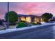 Beautifully landscaped front yard with stone accents, mature trees and a spacious driveway at 2784 Cherrydale Falls Dr, Henderson, NV 89052