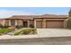 Inviting single-story home with stone accents, tile roof, and manicured landscaping at 2784 Cherrydale Falls Dr, Henderson, NV 89052