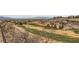 Panoramic view of a lush golf course highlighting green fairways and scenic terrain at 2784 Cherrydale Falls Dr, Henderson, NV 89052