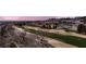 Beautiful aerial view of a golf course surrounded by desert landscaping and homes at 2784 Cherrydale Falls Dr, Henderson, NV 89052