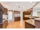 Spacious kitchen with granite countertops, stainless steel appliances, and hardwood floors at 2784 Cherrydale Falls Dr, Henderson, NV 89052
