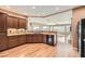 Kitchen featuring granite countertops, stainless steel appliances, and hardwood floors at 2784 Cherrydale Falls Dr, Henderson, NV 89052