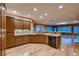 Stylish kitchen featuring granite countertops, a breakfast bar, and stainless steel appliances at 2784 Cherrydale Falls Dr, Henderson, NV 89052