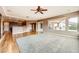 Spacious living room with view of the kitchen, access to the back yard and lots of natural light at 2784 Cherrydale Falls Dr, Henderson, NV 89052