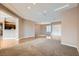 Open living space featuring hardwood floors, neutral walls, and ample lighting fixtures at 2784 Cherrydale Falls Dr, Henderson, NV 89052
