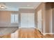 Spacious living room with hardwood floors, plantation shutters, and neutral paint at 2784 Cherrydale Falls Dr, Henderson, NV 89052