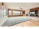 Large living room with hardwood floors, view of the city and a fireplace at 2784 Cherrydale Falls Dr, Henderson, NV 89052