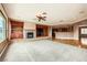 Spacious open concept living room with a fireplace and view of the kitchen at 2784 Cherrydale Falls Dr, Henderson, NV 89052