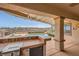 This outdoor kitchen has a built in grill, counter space, and a beverage fridge at 2784 Cherrydale Falls Dr, Henderson, NV 89052