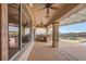 Covered patio showcasing outdoor kitchen, barbecue, and beautiful mountain views at 2784 Cherrydale Falls Dr, Henderson, NV 89052