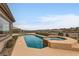 Private pool with a hot tub, desert landscape and scenic neighborhood views at 2784 Cherrydale Falls Dr, Henderson, NV 89052